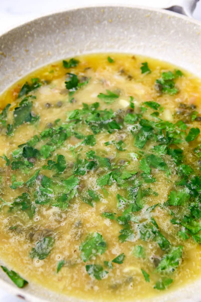 Vegan piccata sauce with broth, lemon, and parsley added.
