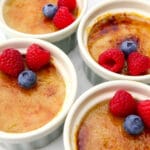 A top view of vegan creme brulee topped with berries.