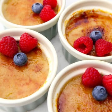 A top view of vegan creme brulee topped with berries.
