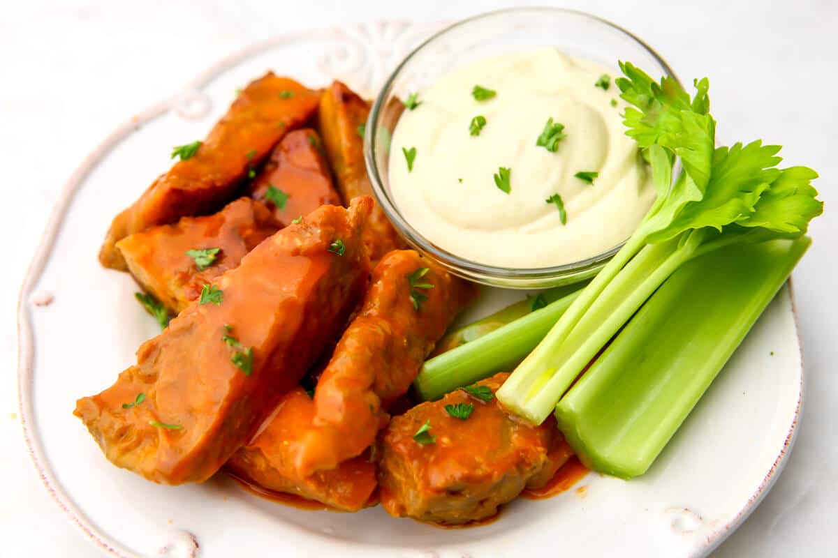Vegan chicken wings with buffalo sauce and ranch dip.