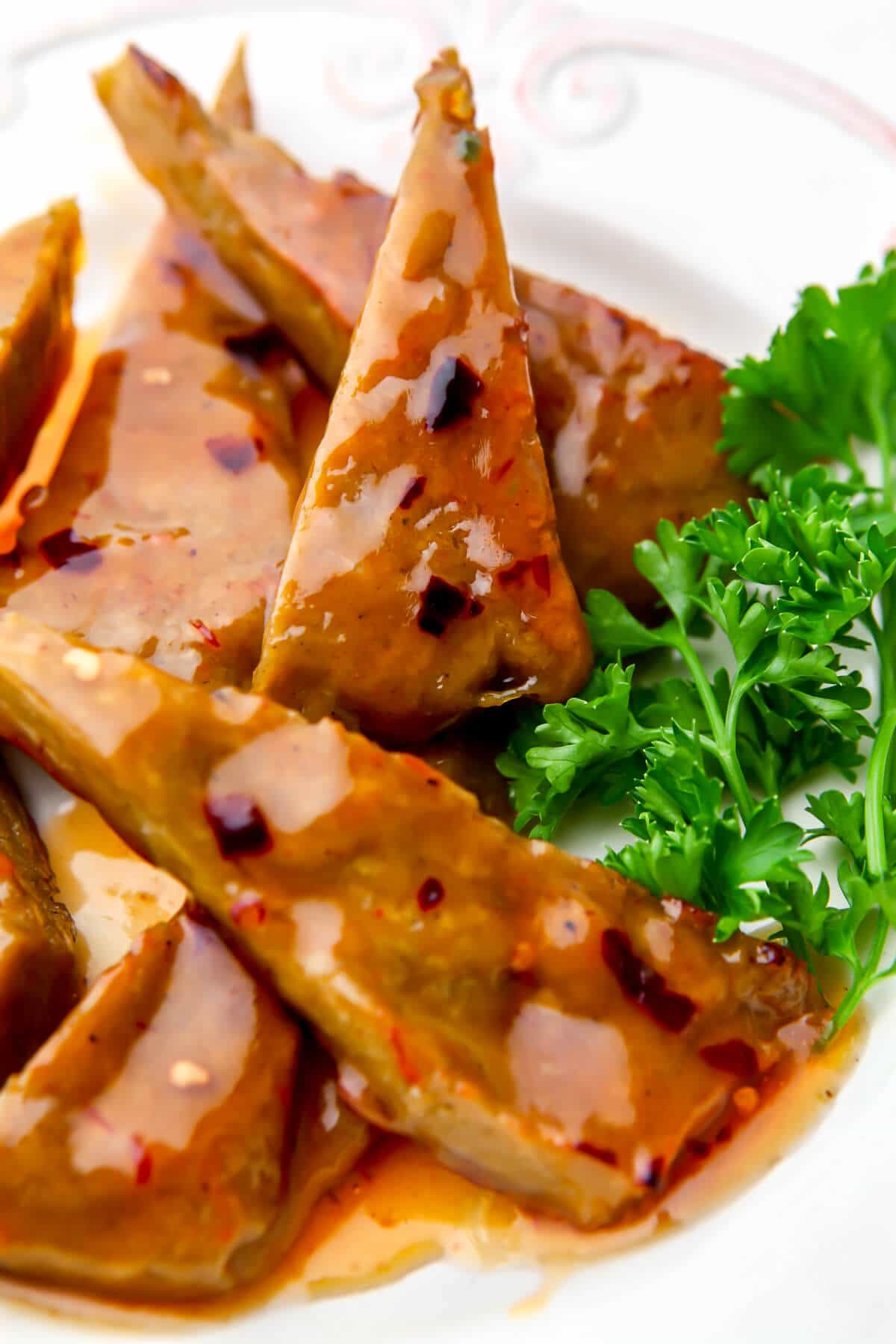 Sweet Thai chili sauce over vegan chicken wings.