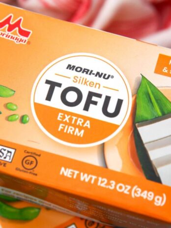 A close up of an orange box of silken tofu.