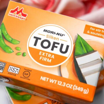 A close up of an orange box of silken tofu.