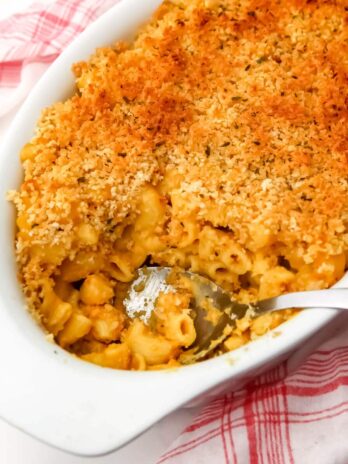 A top view of a casserole dish filled with baked vegan mac and cheese.