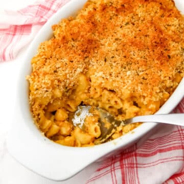 A top view of a casserole dish filled with baked vegan mac and cheese.