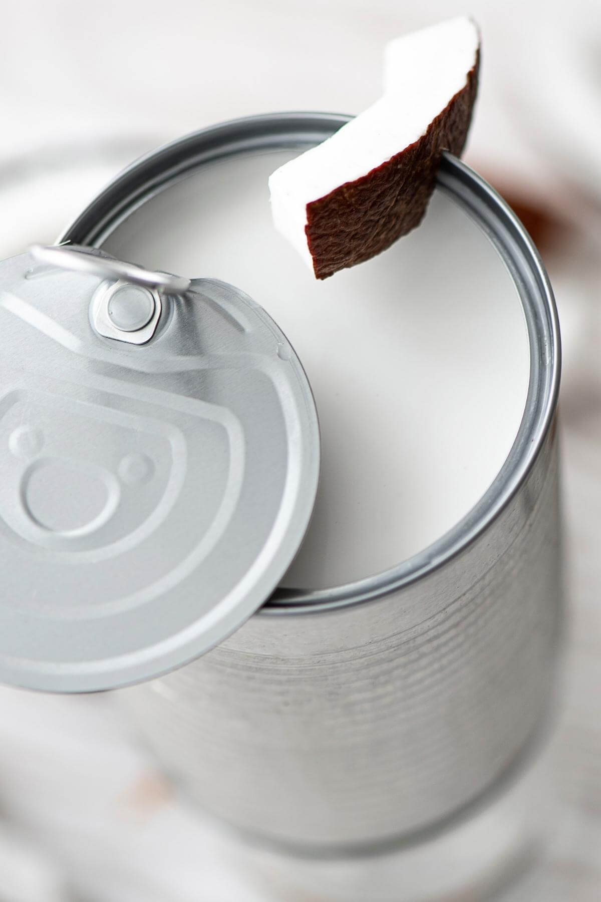 An open can of coconut milk.