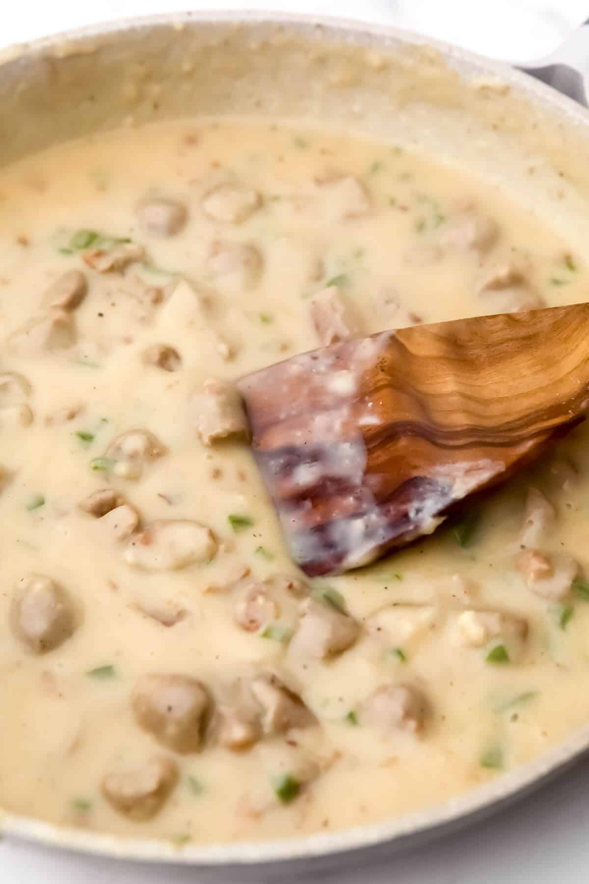 Vegan sausage gravy in a skillet after it has been thickened.