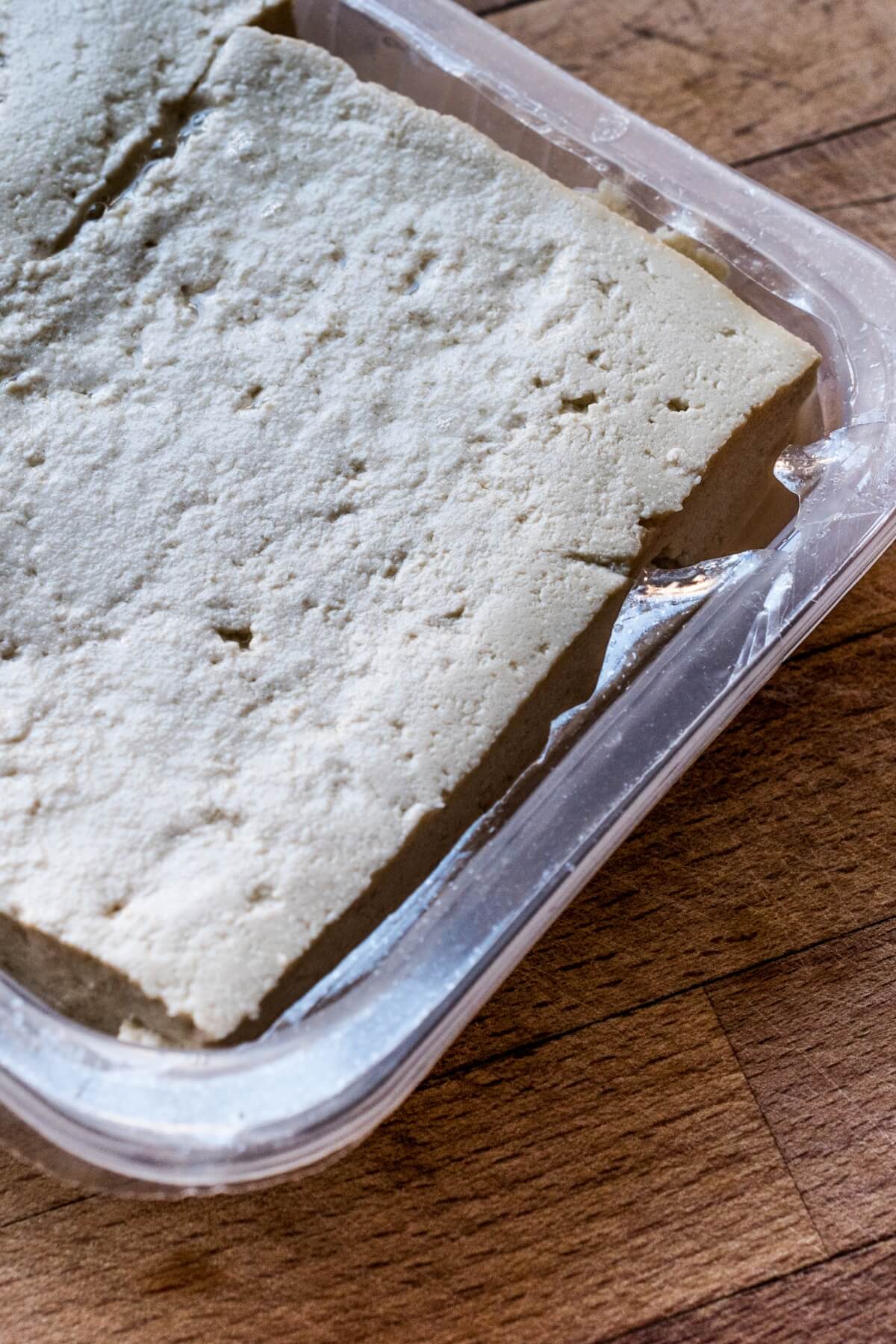 A block of tofu in a plastic package.