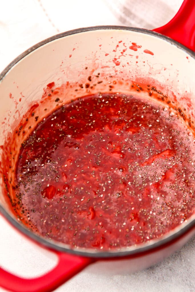 Chia jam after the strawberries have been cooked and the chia seeds have been added.