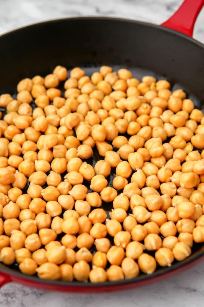 Chickpeas in an iron skillet before cooking.