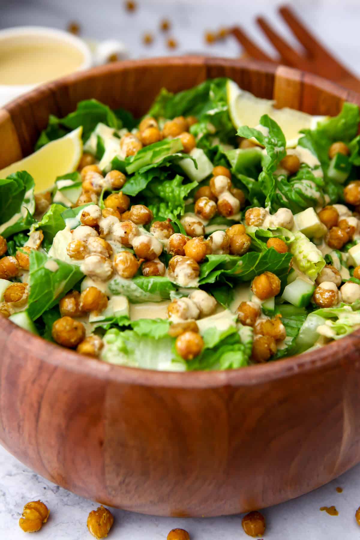 A healthy Caesar salad topped with tahini Caesar dressing and chickpea croutons.
