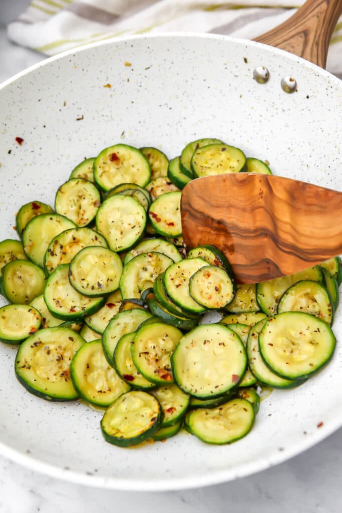 The sliced zucchini after it has been sauteed.