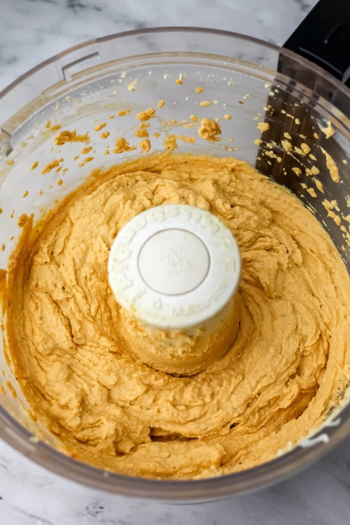 Vegan pumpkin ricotta blended in a food processor.