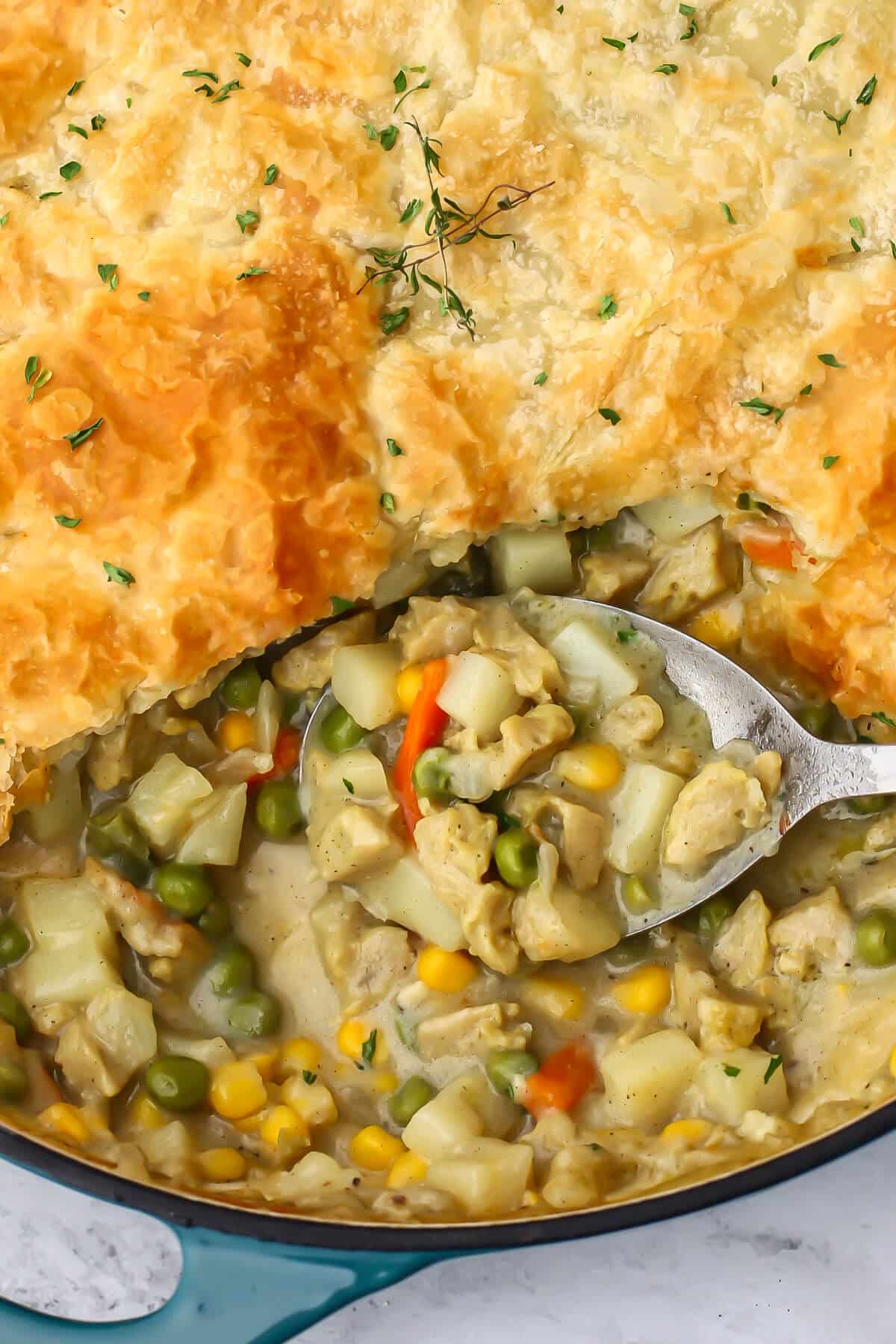 A close up of a vegan pot pie with a puff pastry topping.