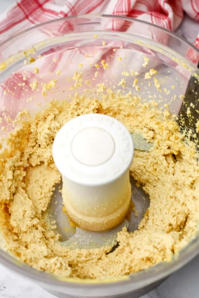 Tofu, garlic, nutritional yeast, and salt blended in a food processor.