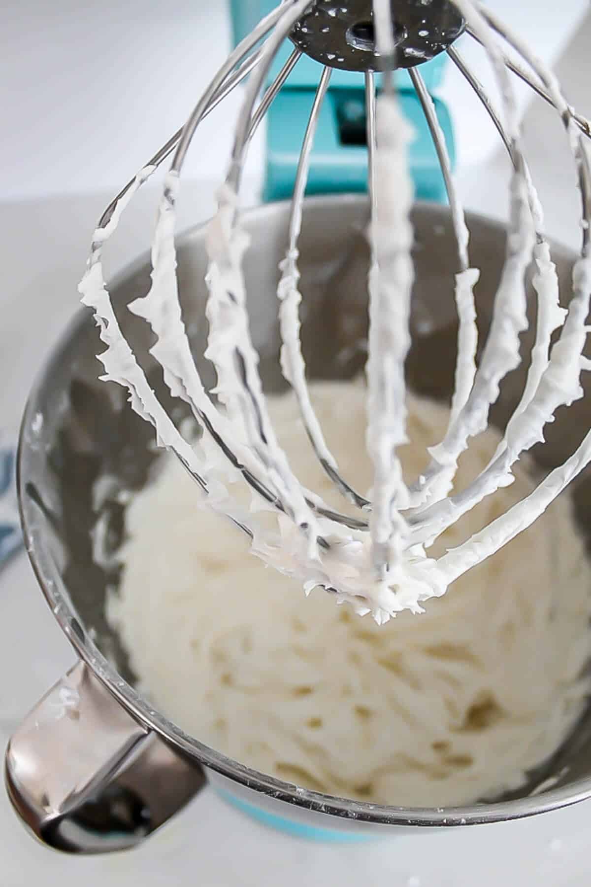 Vegan lemon frostings whipped with an electric mixer.