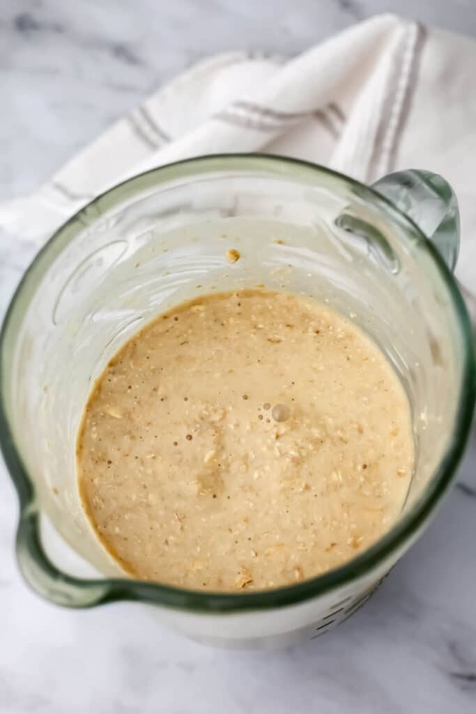 Blended oats, banana, apple sauce and sweetener to make blender oatmeal cups.