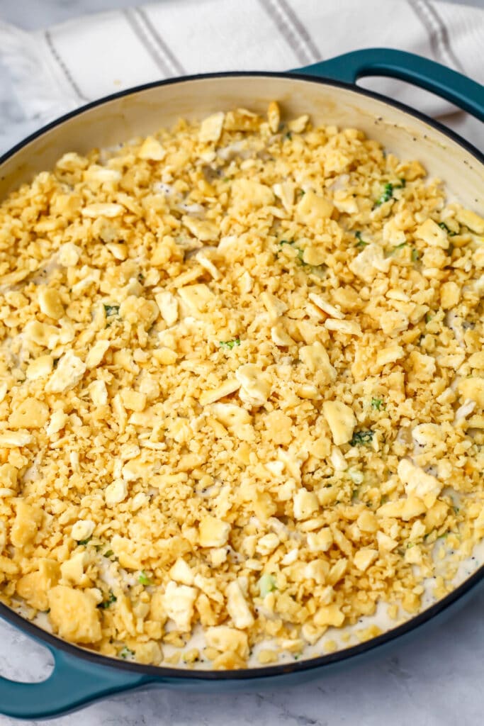 A vegan chicken casserole topped with buttery crackers before baking.