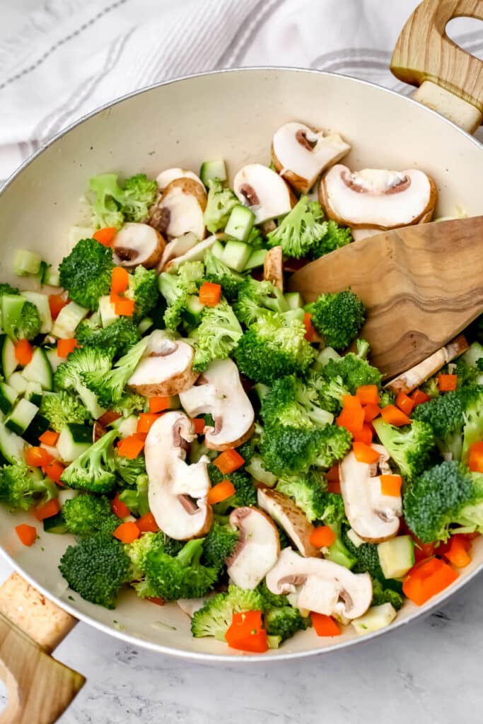 Fresh vegetables in a wok to make creamy veggies pasta.