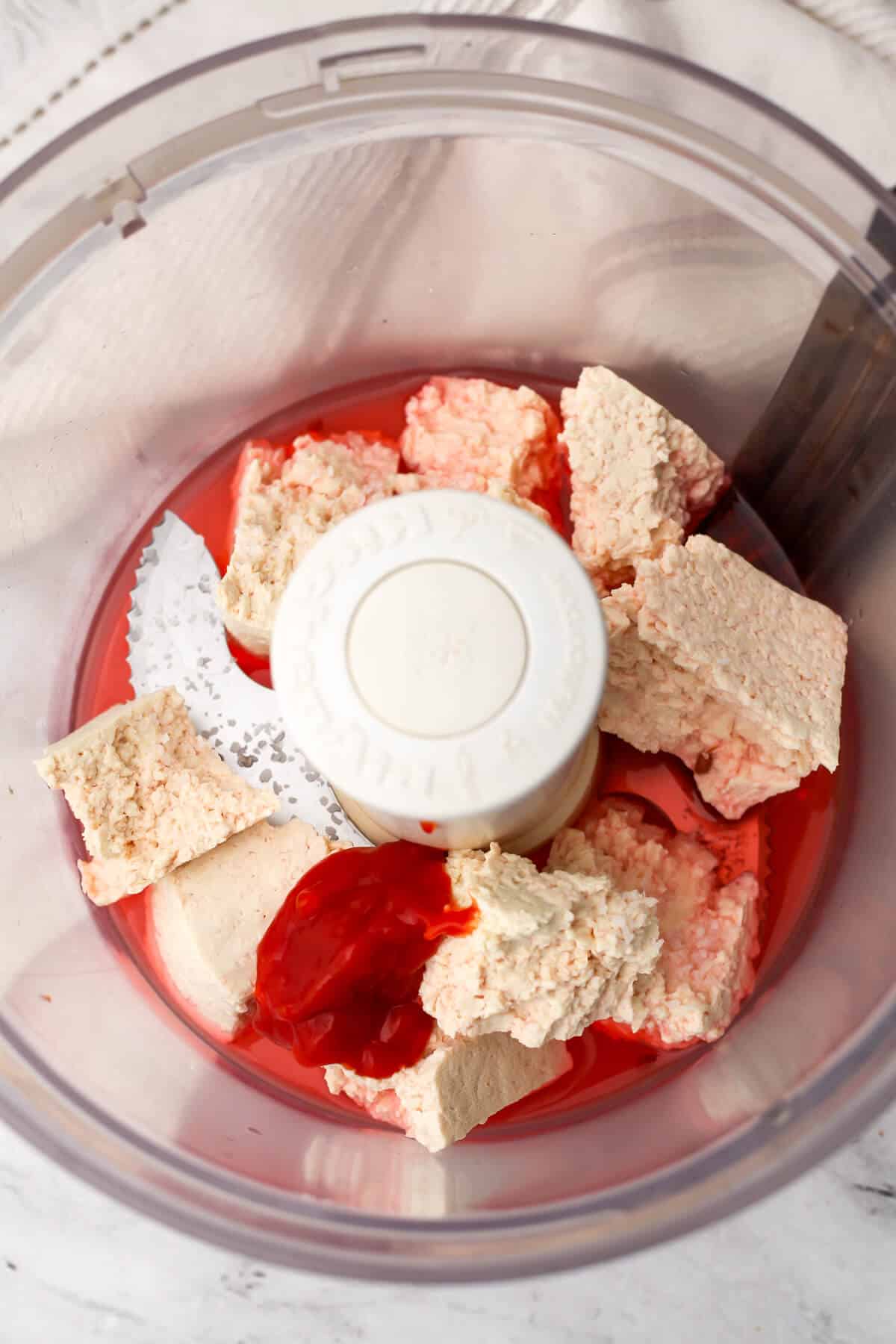 Tofu, ketchup, and broth in a food processor to make seitan corned beef.