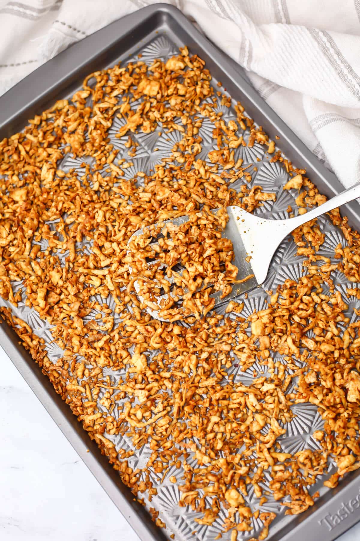 Shredded tofu on a sheet pan after baking.