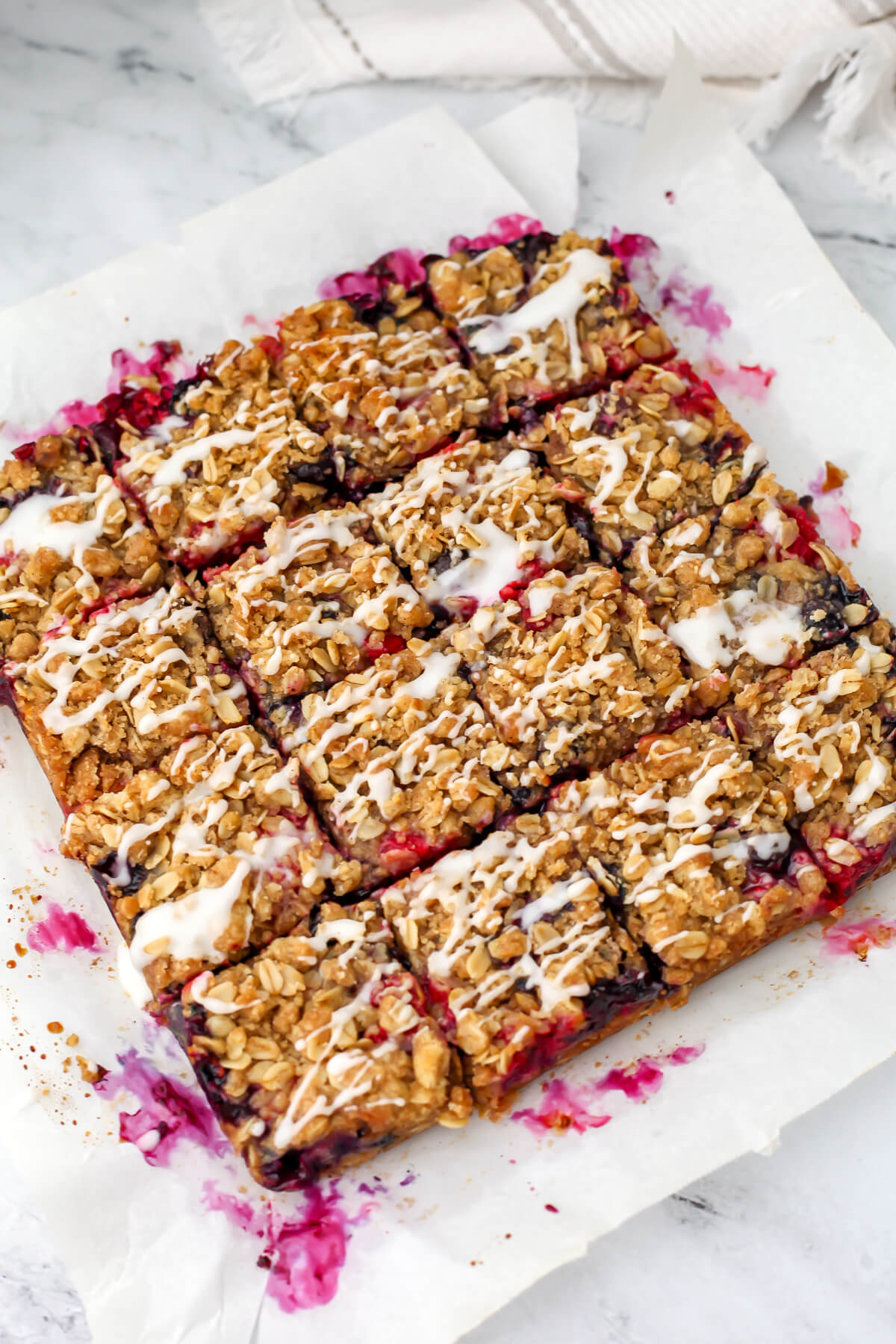 The berry crumble bars cut into 16 equal pieces.