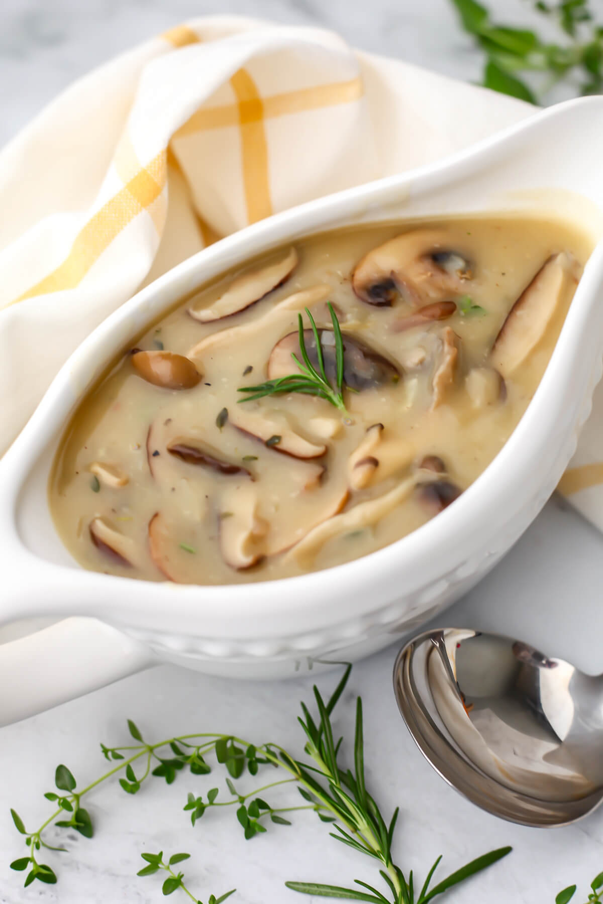 A gravy boat filled with vegan wild mushroom gravy.