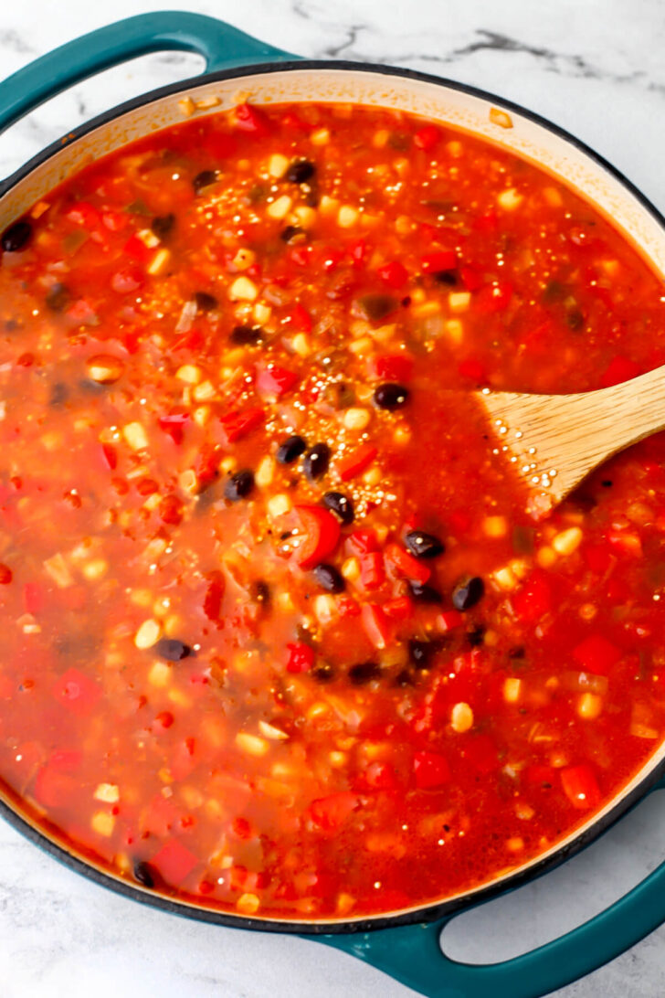 A jar of salsa and water added to the corn and beans to make Mexican quinoa.