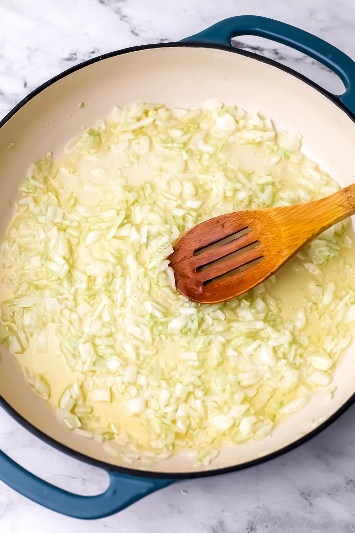 Onions and garlic sauteing in oil. 