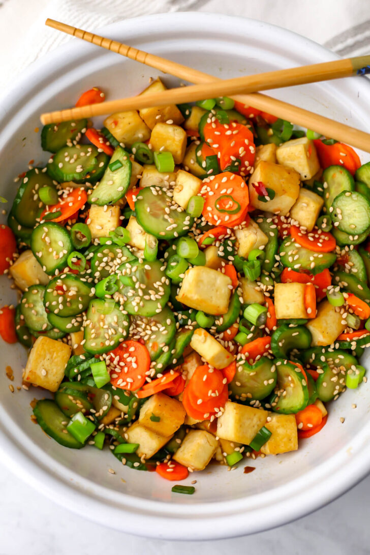 A top view of a tofu cucumber salad.