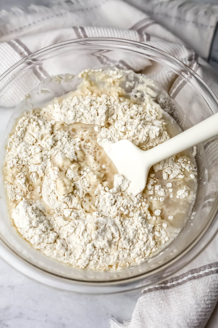 Flour, water, salt, and yeast mixing to make bread.