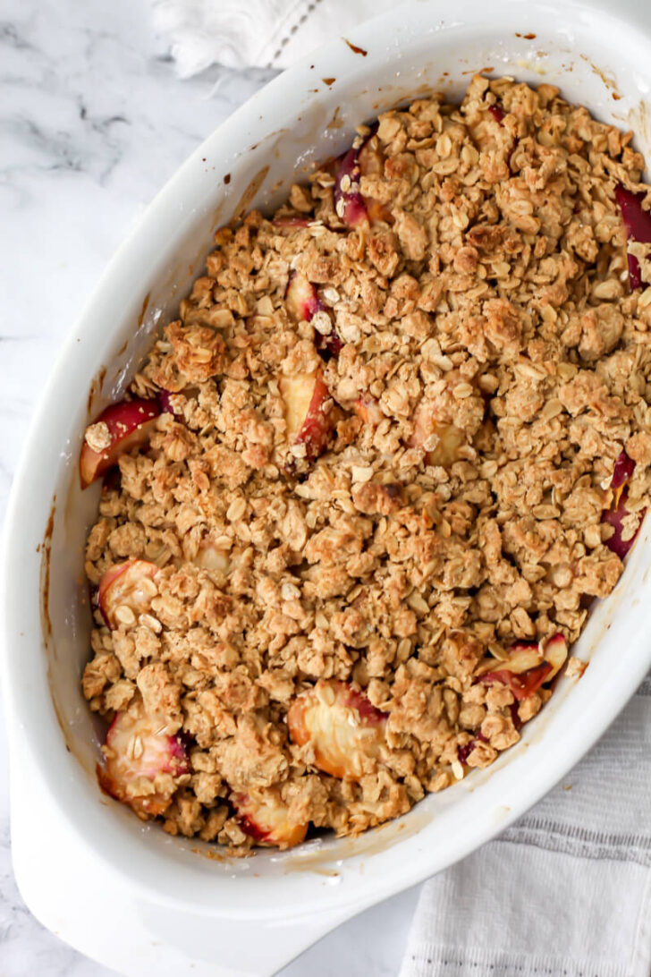 A vegan peach crumble after it has baked.