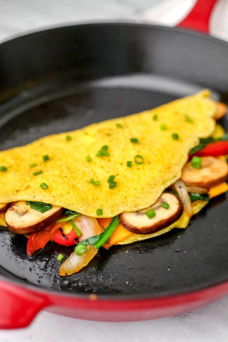 A vegan omelet made with Just Egg and filled with sautéed veggies.