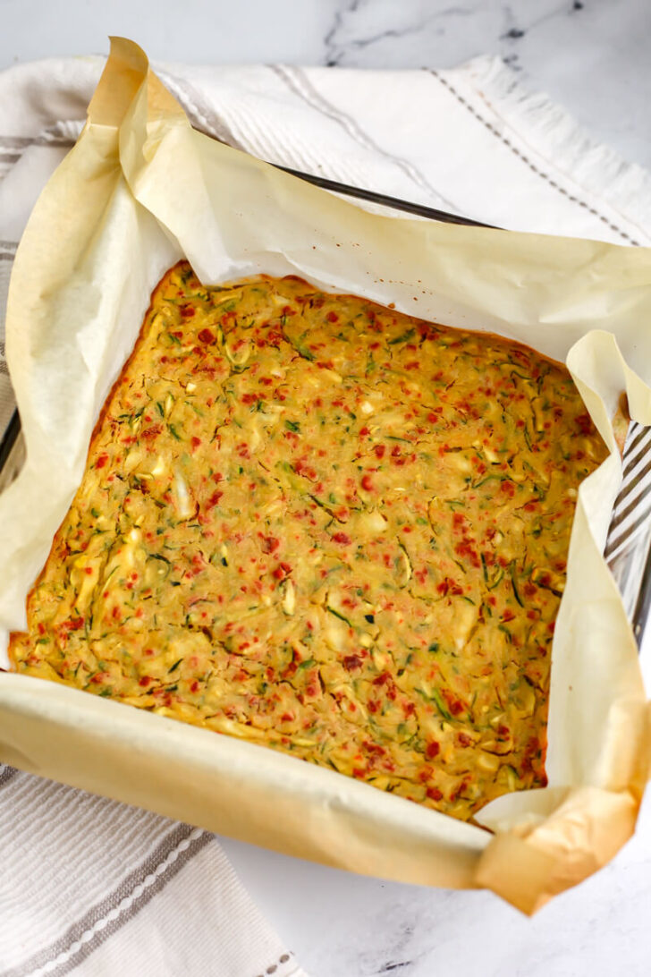 The vegan zucchini slice after it has been baked.