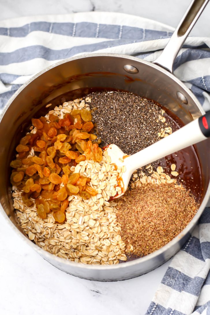 Oats, raisins, ground flaxseeds, and chia seeds added to the chocolate mixture.