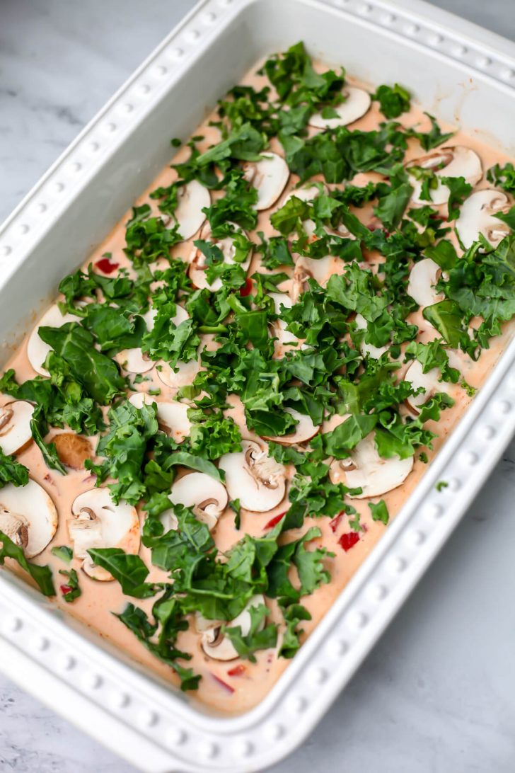 Red bell peppers, mushrooms, and kale added to red curry sauce.
