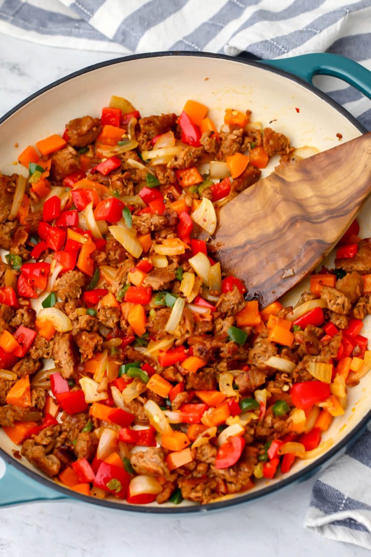 Vegan breakfast sausage added to the onions and peppers.