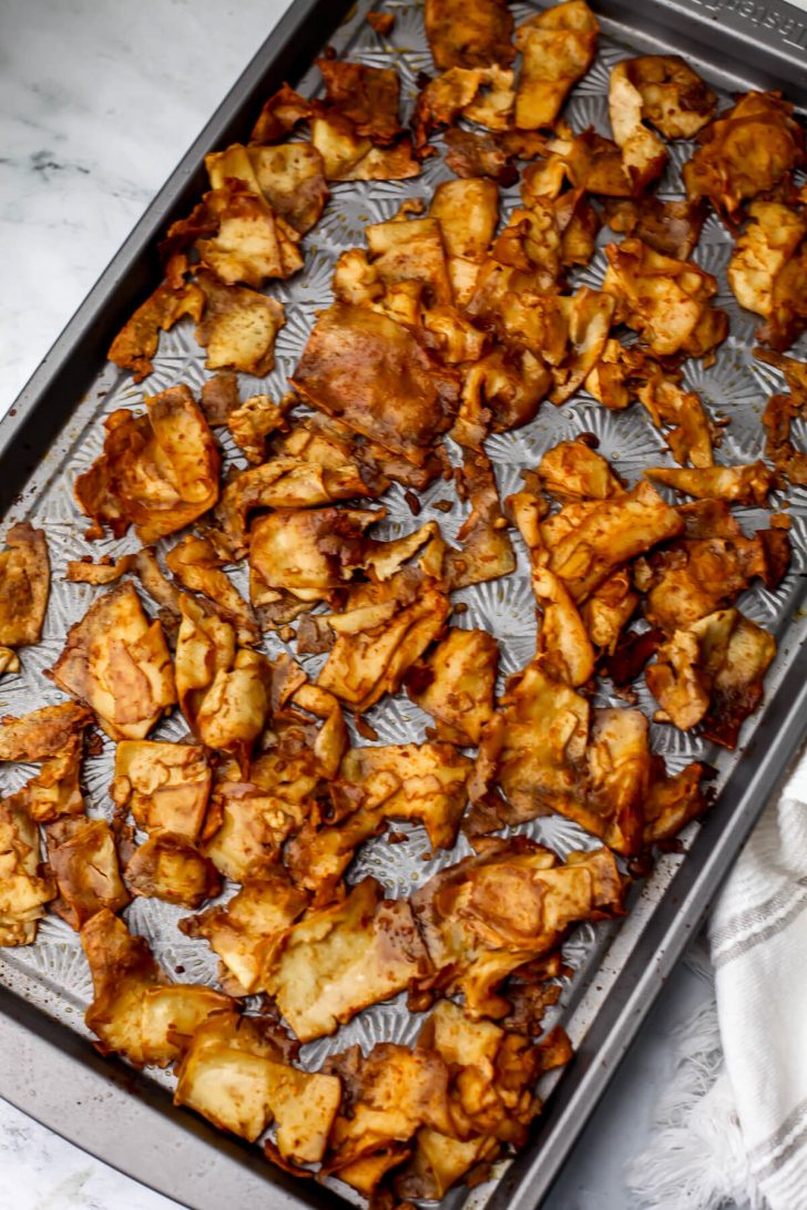A top view of marinated shaved tofu after it has cooked on a sheet pan.