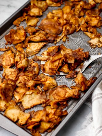 A sheet pan with shaved marinated tofu to make a vegan tofu deli meat.
