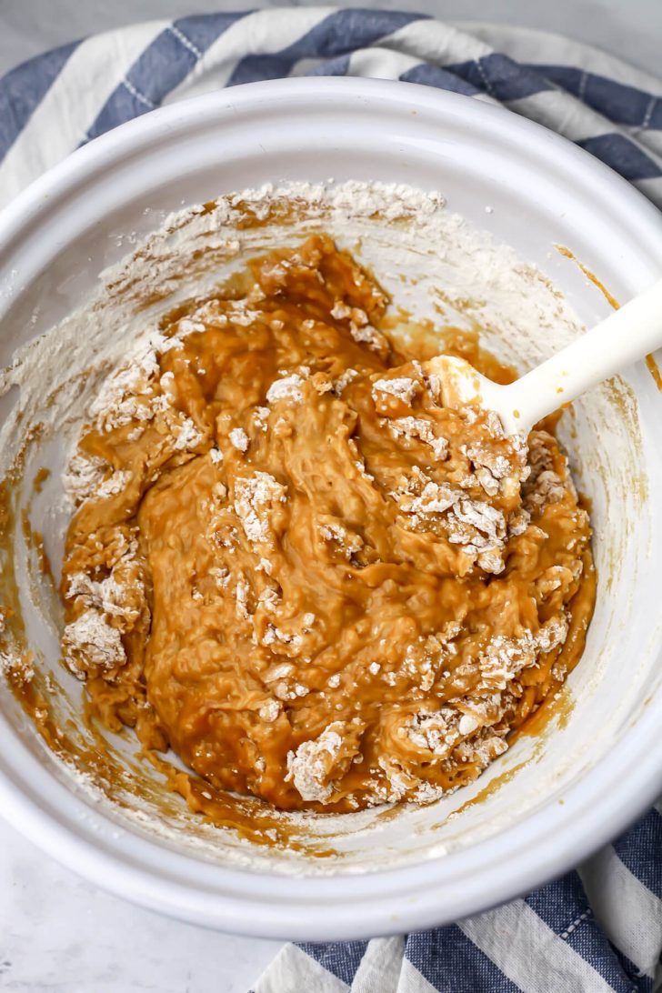 Dry ingredients added to the vegan banana pumpkin bread batter.