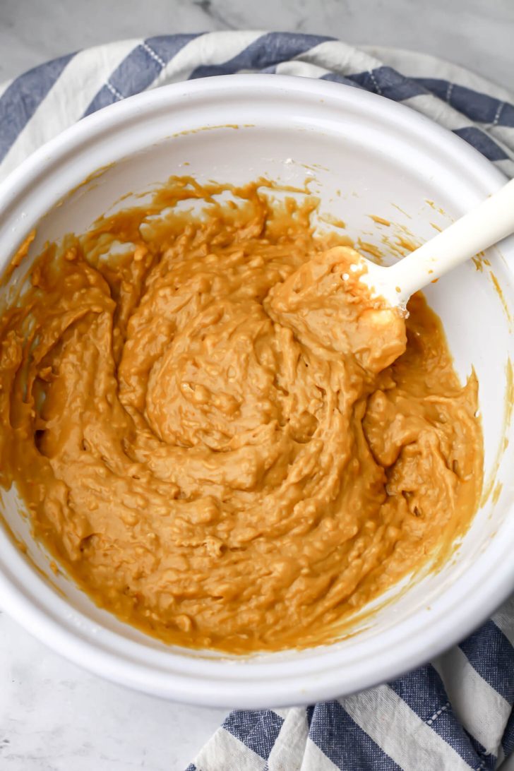 Vegan banana pumpkin bread batter mixed in a white bowl.