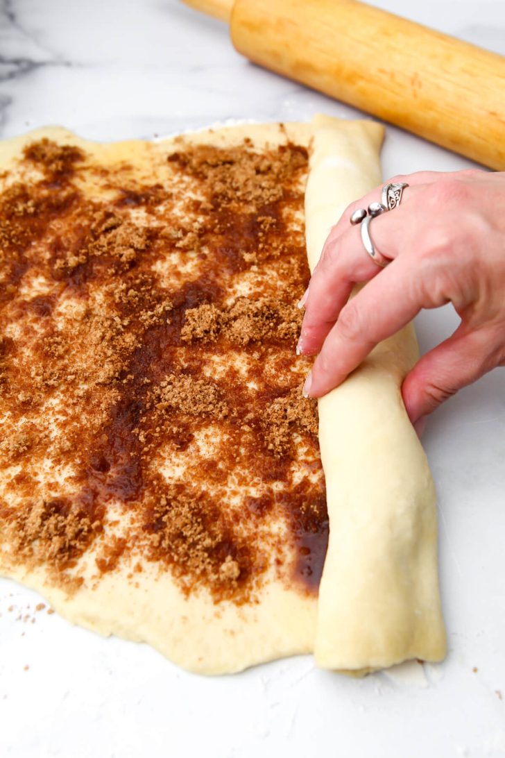 Rolling the vegan sticky buns up.
