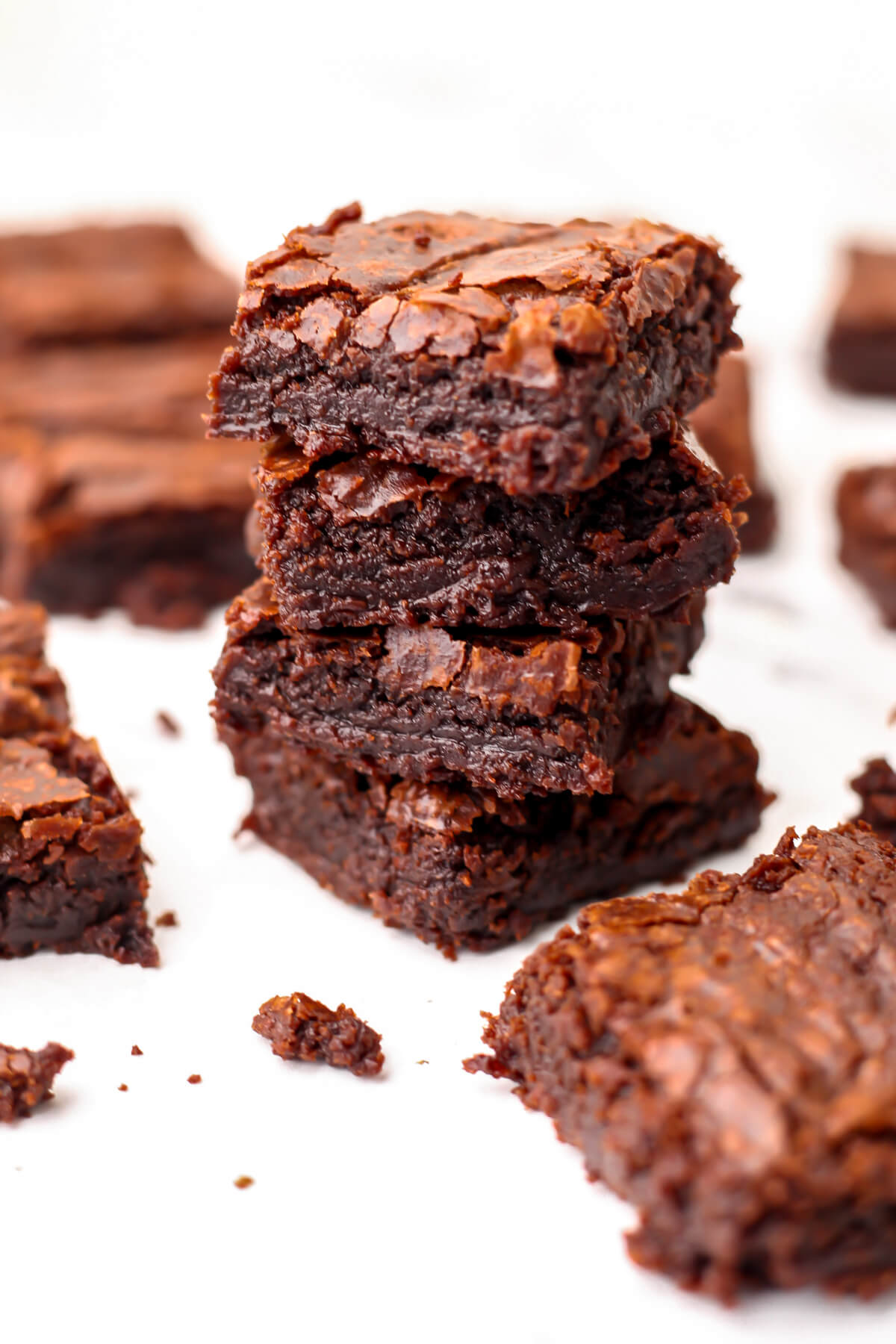 Vegan brownies made from a mix stacked on top of eachother.