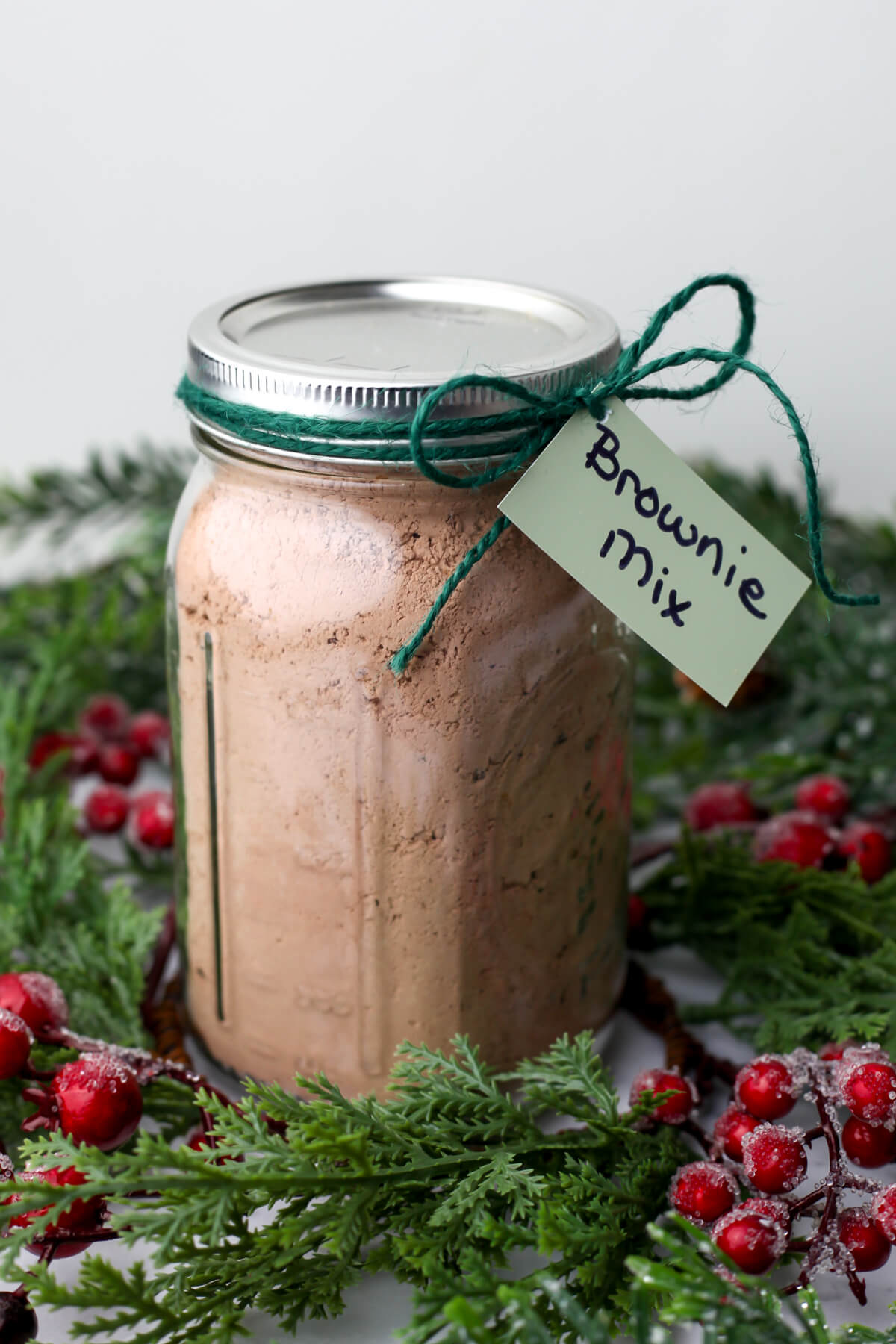 Homemade vegan brownie mix in a jar for a gift.