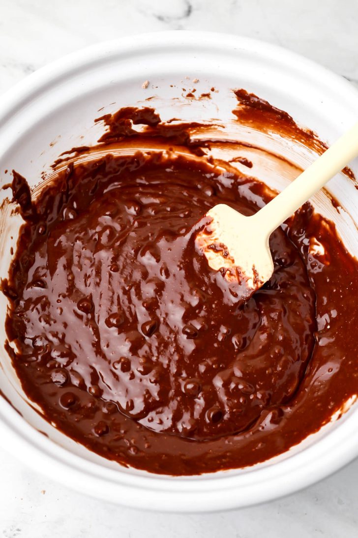 Vegan brownie batter in a white bowl.