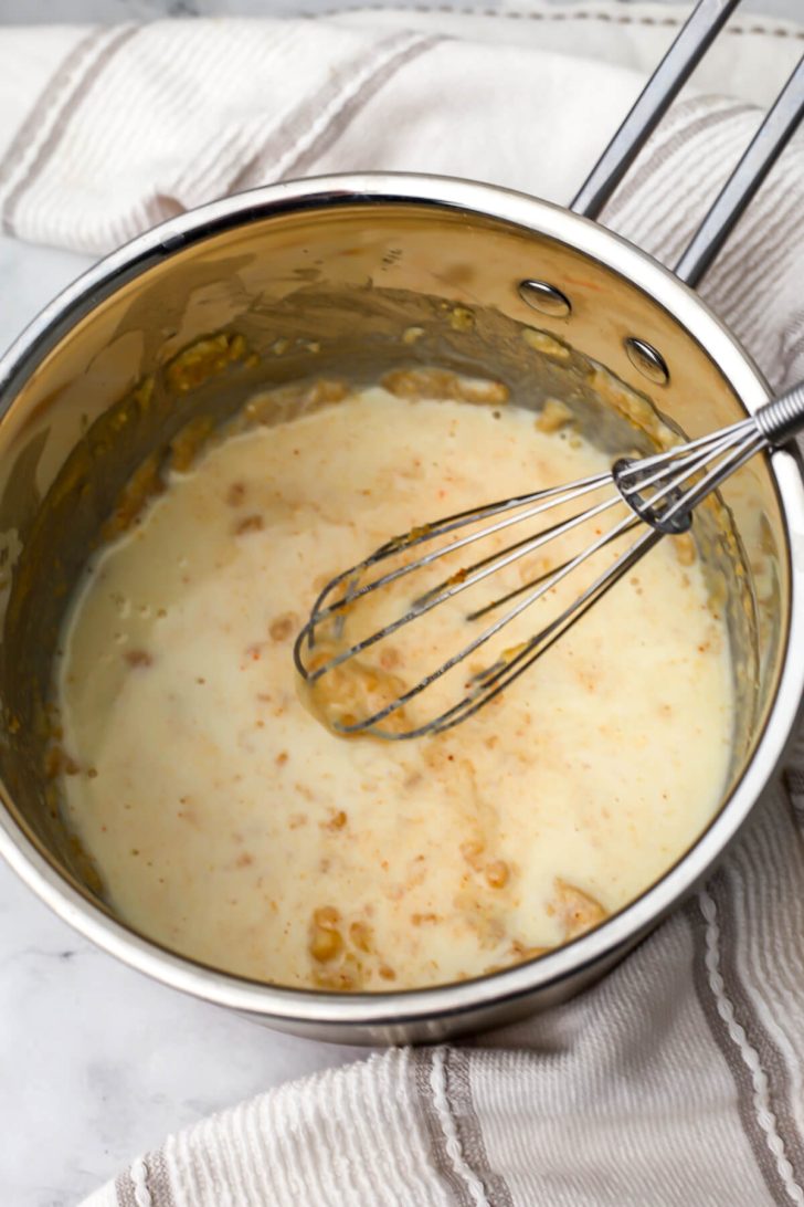 Soy milk added to the roux to make vegan beer cheese.