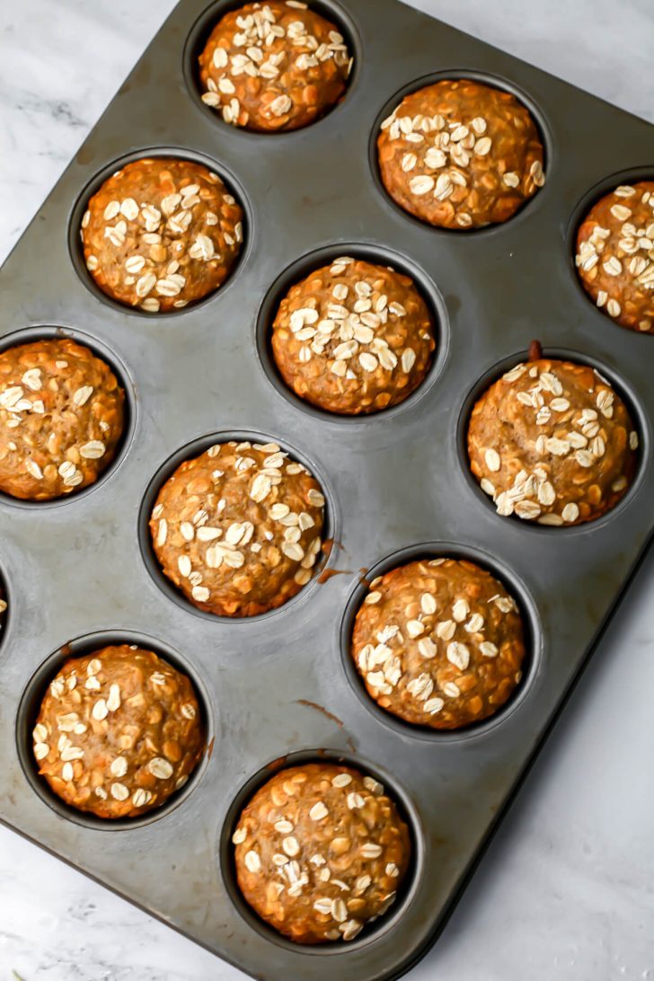 Vegan oat muffins in the muffin tin after they have baked.