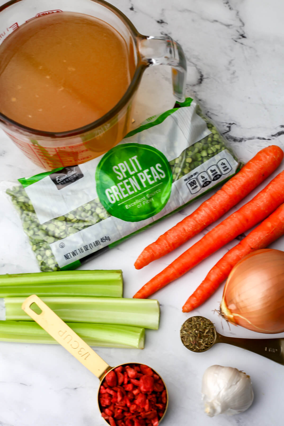 The ingredients to make a vegan split peas soup in a slow cooker.