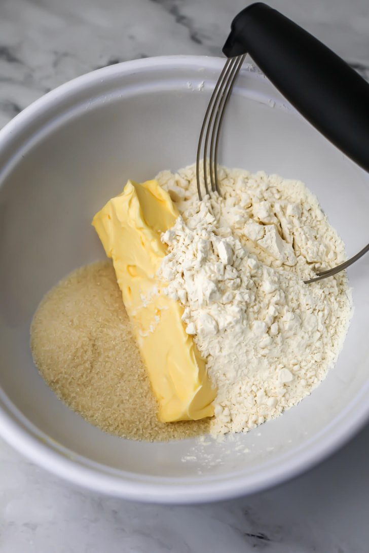 Butter, sugar, and flour to make a shortbread tart base.