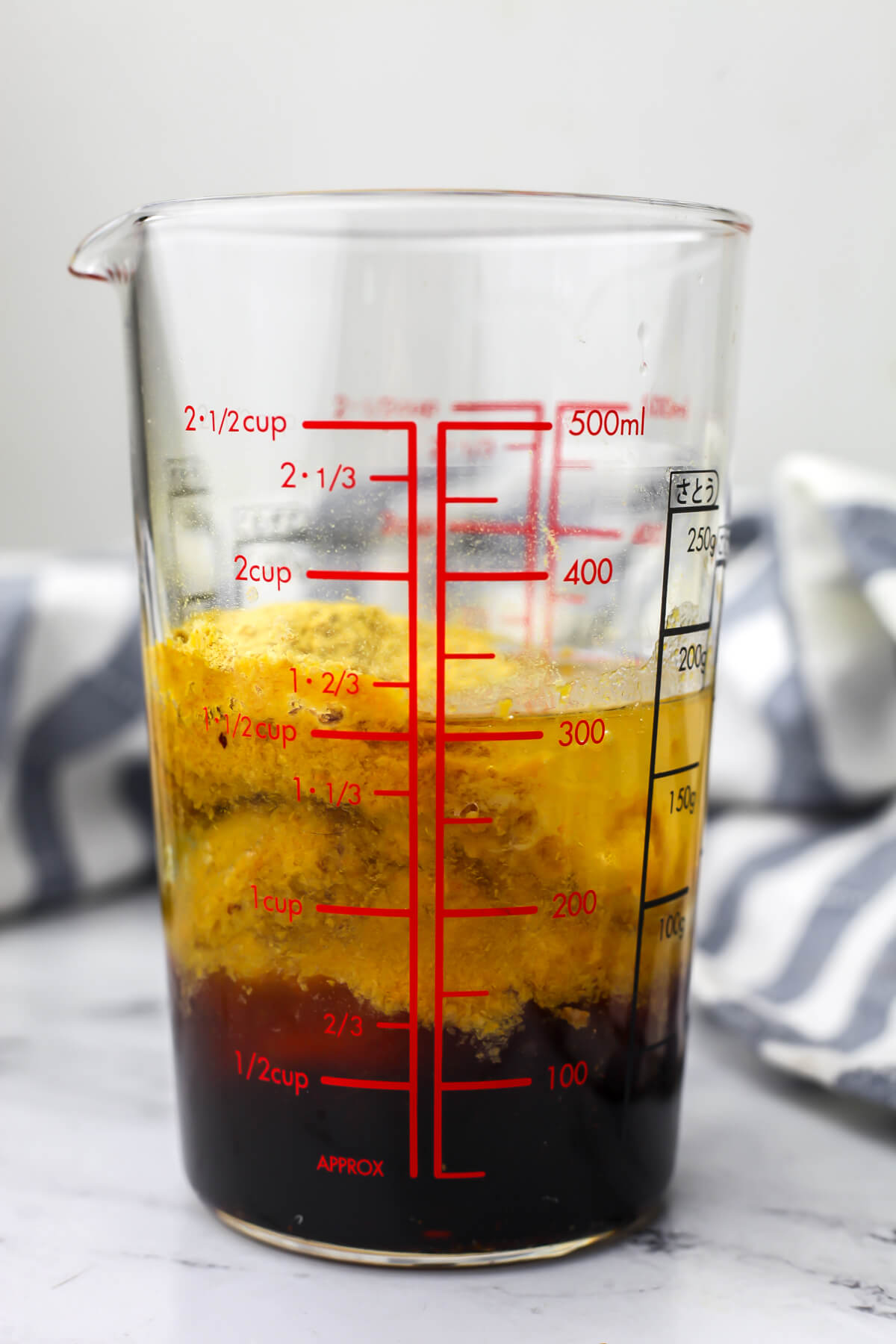 All of the ingredients for nutritional yeast dressing in an immersion blender container before blending.